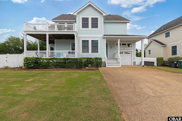759 Ridge Point Dr Lot 42, Corolla, NC 27927 - view of front of house with concrete driveway, a garage, roof with shingles, and covered porch