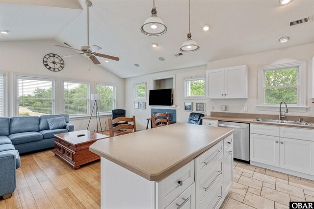 759 Ridge Point Dr Lot 42, Corolla, NC 27927 - kitchen with dishwasher, a sink, open floor plan, a ceiling fan, and plenty of natural light