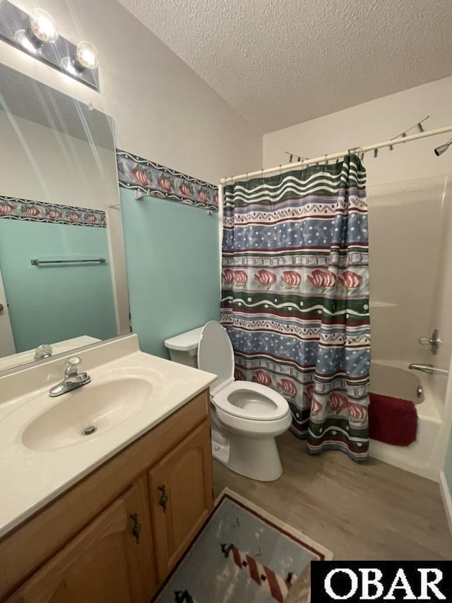 25273 Sea Isle Hills Dr Lot 5-2, Waves, NC 27982 - full bathroom with a textured ceiling, wood finished floors, vanity, toilet, and shower / bath combo