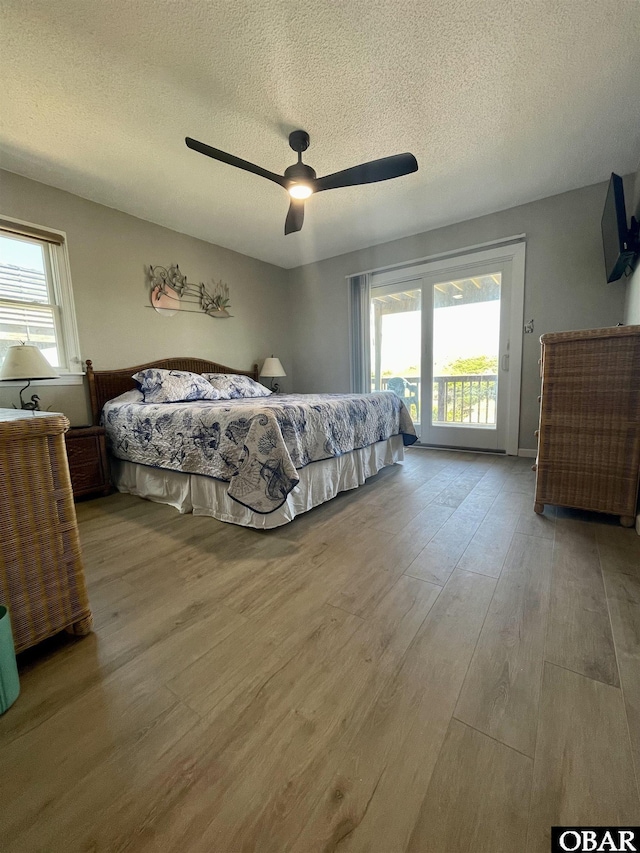 25273 Sea Isle Hills Dr Lot 5-2, Waves, NC 27982 - bedroom featuring access to outside, wood finished floors, a textured ceiling, and ceiling fan