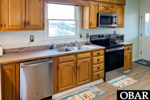 25273 Sea Isle Hills Dr Lot 5-2, Waves, NC 27982 - kitchen with appliances with stainless steel finishes, light countertops, and brown cabinets