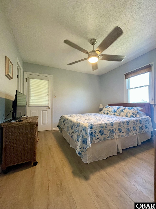 25273 Sea Isle Hills Dr Lot 5-2, Waves, NC 27982 - bedroom with light wood finished floors, a textured ceiling, and a ceiling fan