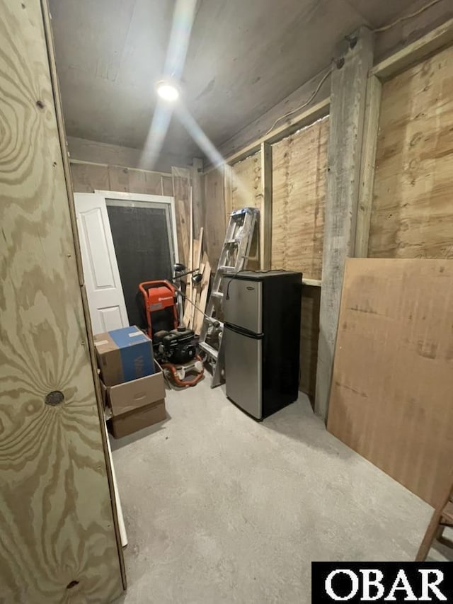 25273 Sea Isle Hills Dr Lot 5-2, Waves, NC 27982 - unfinished below grade area featuring freestanding refrigerator and wood walls