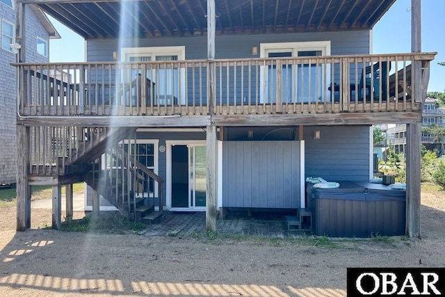 25273 Sea Isle Hills Dr Lot 5-2, Waves, NC 27982 - rear view of property featuring a hot tub, stairway, and a wooden deck