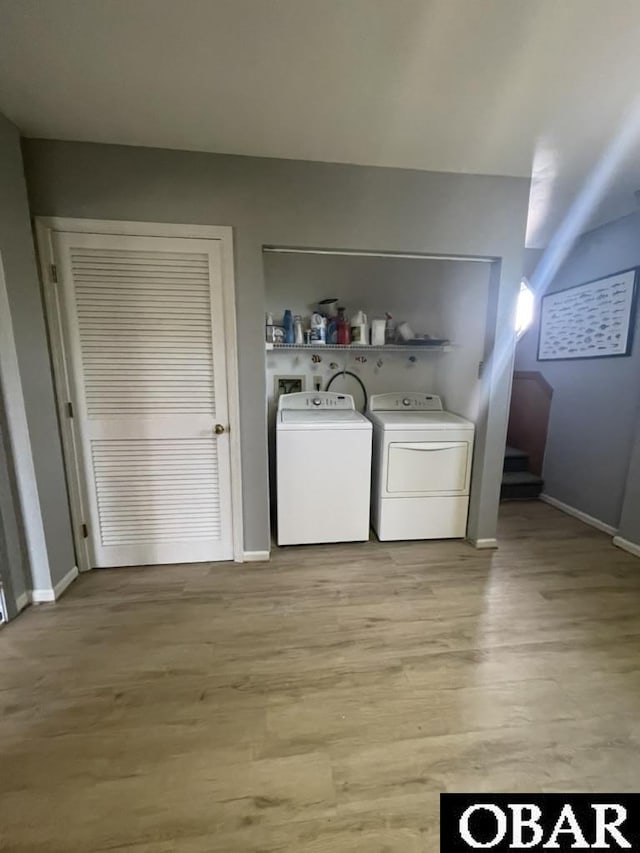 25273 Sea Isle Hills Dr Lot 5-2, Waves, NC 27982 - washroom with washing machine and clothes dryer, light wood-style floors, and baseboards