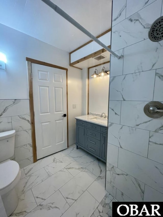 25273 Sea Isle Hills Dr Lot 5-2, Waves, NC 27982 - bathroom featuring a tile shower, vanity, and marble finish floors