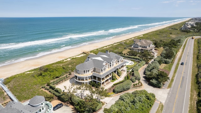 bird's eye view with a water view and a view of the beach