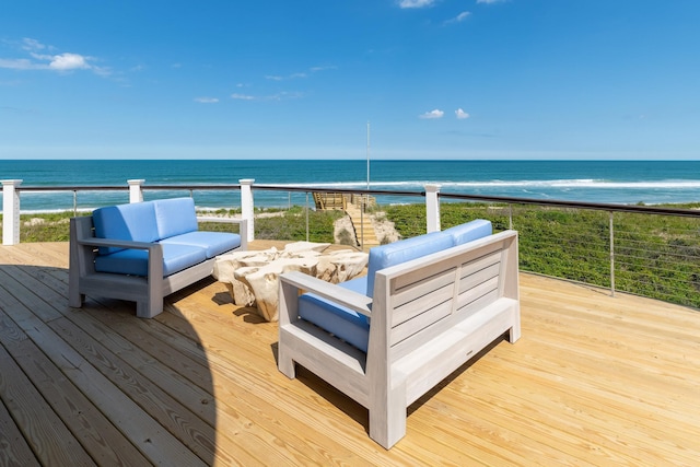 wooden terrace featuring a water view