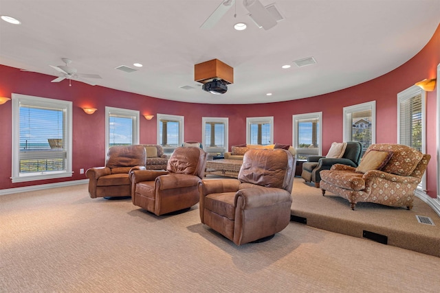 home theater room featuring ceiling fan, recessed lighting, visible vents, and light colored carpet