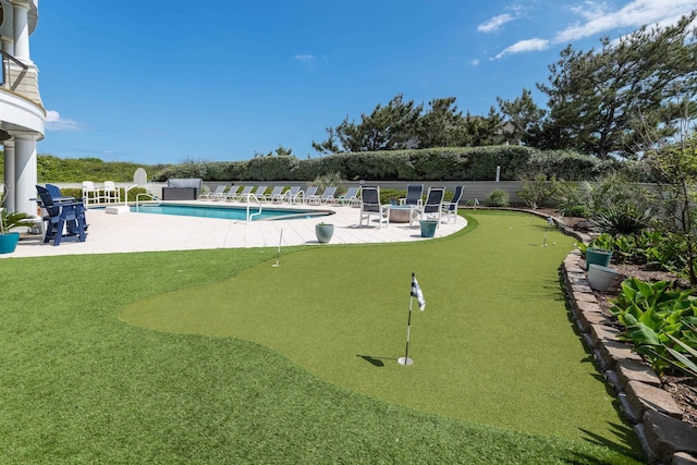 pool featuring a patio area and a fenced backyard