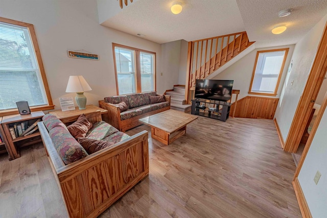 40270 Croaker Ct Lot D, Avon, NC 27915 - living area with stairs, light wood finished floors, a textured ceiling, plenty of natural light, and baseboards