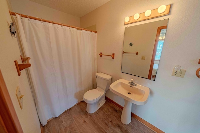 40270 Croaker Ct Lot D, Avon, NC 27915 - full bath featuring toilet, wood finished floors, a textured ceiling, and a shower with shower curtain