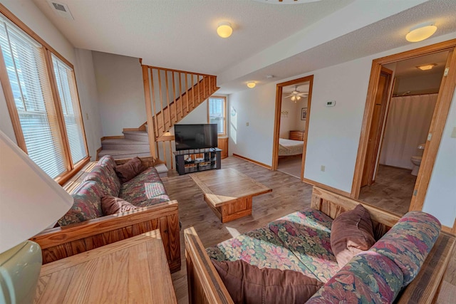 40270 Croaker Ct Lot D, Avon, NC 27915 - living area with stairway, wood finished floors, baseboards, and a textured ceiling