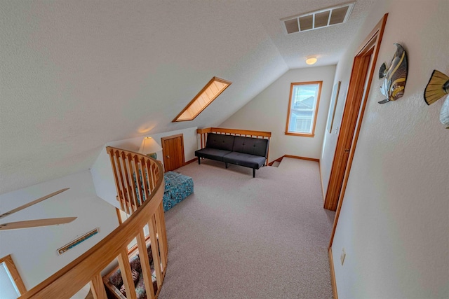 40270 Croaker Ct Lot D, Avon, NC 27915 - carpeted bedroom featuring a textured ceiling, lofted ceiling, and a skylight