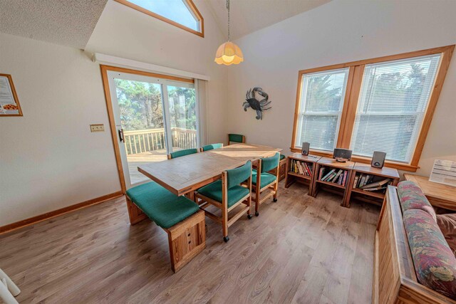40270 Croaker Ct Lot D, Avon, NC 27915 - dining area with lofted ceiling, light wood finished floors, and baseboards
