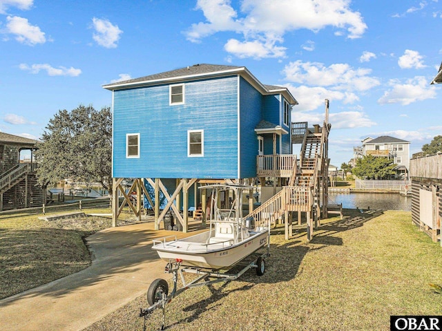 50096 Freebooter Ct Lot 178, Frisco, NC 27936 - back of property featuring a carport, a water view, and a lawn