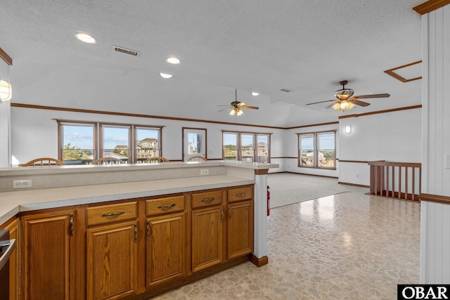 50096 Freebooter Ct Lot 178, Frisco, NC 27936 - kitchen featuring brown cabinetry, visible vents, light countertops, and open floor plan