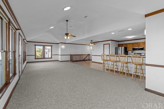 50096 Freebooter Ct Lot 178, Frisco, NC 27936 - unfurnished living room with vaulted ceiling, ornamental molding, light carpet, and baseboards
