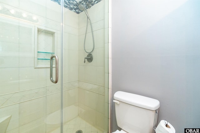 full bath featuring toilet and a stall shower