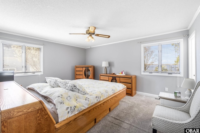 carpeted bedroom with a ceiling fan, crown molding, baseboards, and a textured ceiling