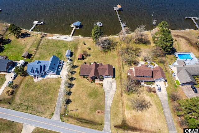 bird's eye view with a residential view and a water view