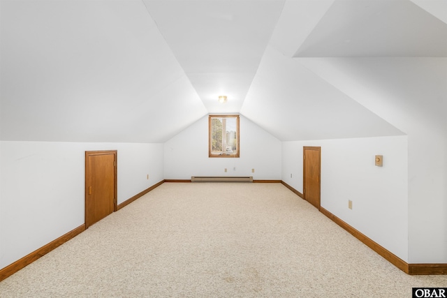 bonus room with baseboards, baseboard heating, carpet flooring, and vaulted ceiling