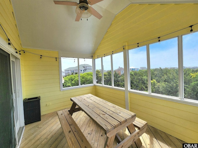 sunroom / solarium featuring ceiling fan and plenty of natural light