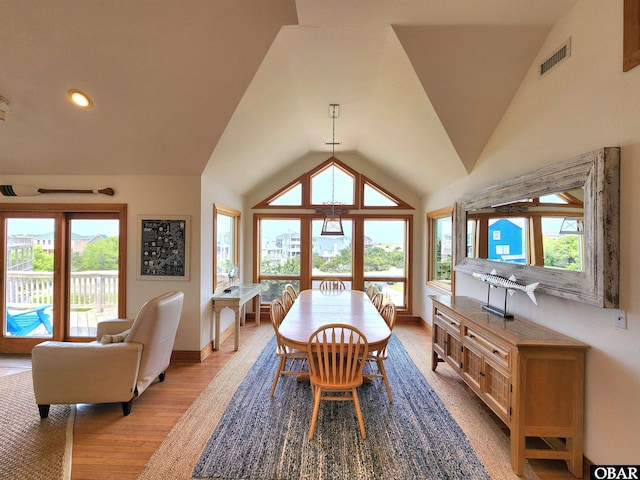 dining room featuring visible vents, a healthy amount of sunlight, and baseboards