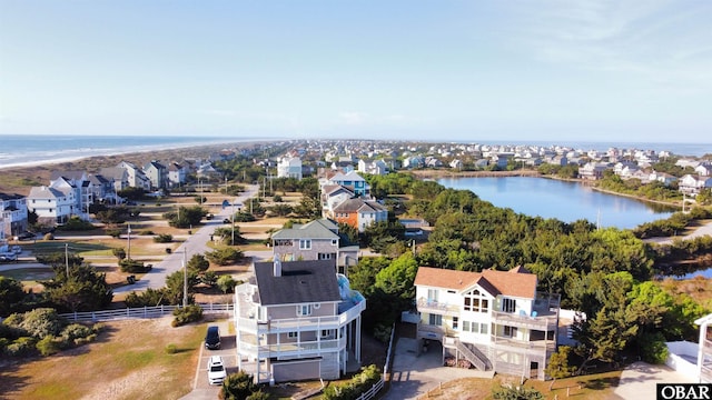 bird's eye view featuring a residential view and a water view