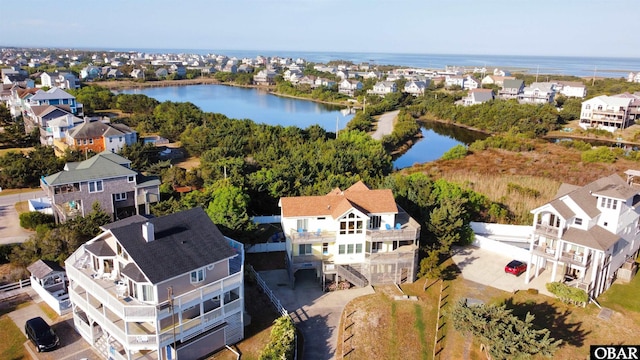 bird's eye view with a residential view and a water view
