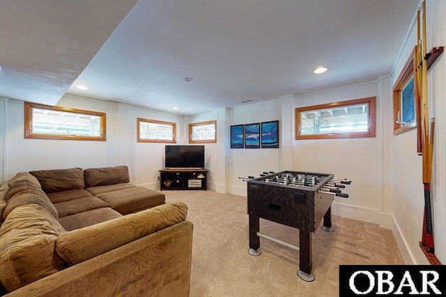game room featuring a decorative wall, recessed lighting, and light colored carpet