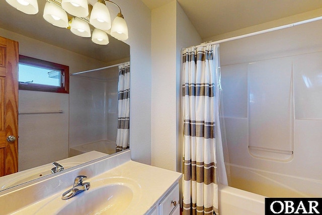 full bathroom featuring shower / bathtub combination with curtain and vanity