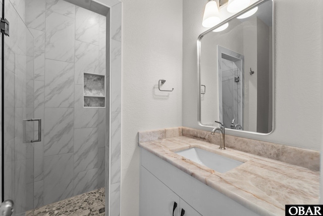 902 S Virginia Dare Trl Unit 703, Kill Devil Hills, NC 27948 - bathroom featuring a stall shower and vanity