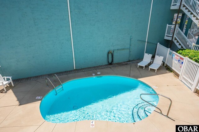 8123 S Old Oregon Inlet Rd Unit 208, Nags Head, NC 27959 - community pool featuring stairs and a patio