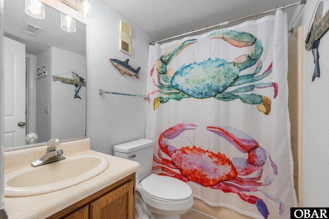 8123 S Old Oregon Inlet Rd Unit 208, Nags Head, NC 27959 - full bath with vanity, a textured ceiling, toilet, curtained shower, and a textured wall