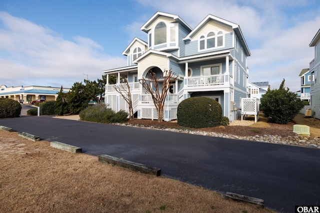 view of front facade with a porch and stairs