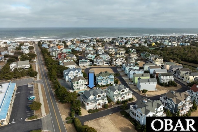 birds eye view of property featuring a water view and a residential view