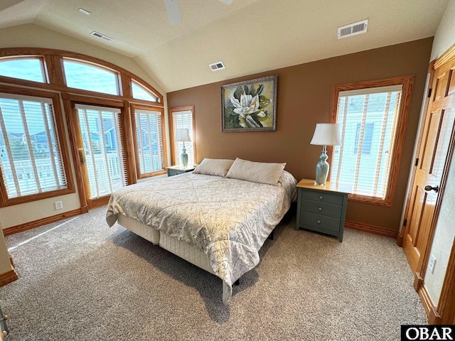 bedroom with lofted ceiling, visible vents, and access to exterior