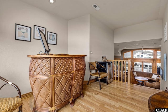 interior space featuring ceiling fan, recessed lighting, wood finished floors, visible vents, and baseboards