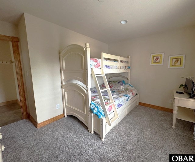 bedroom with light carpet and baseboards