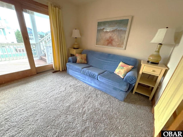 living area featuring carpet flooring