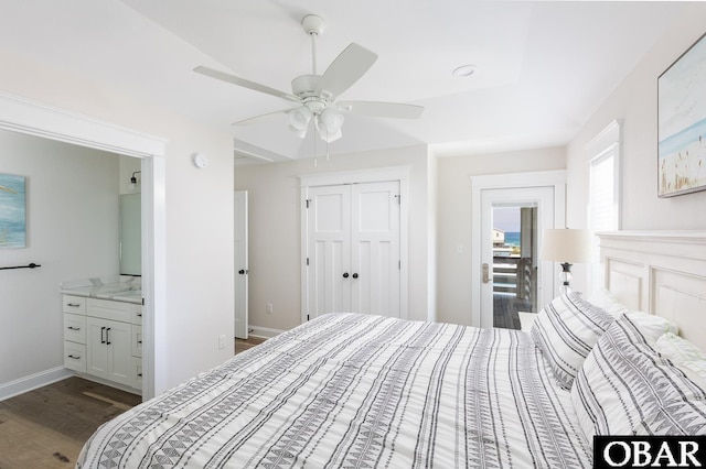 205 E Eckner St Lot # 17, Kitty Hawk, NC 27949 - bedroom featuring dark wood finished floors, ensuite bath, a closet, ceiling fan, and baseboards