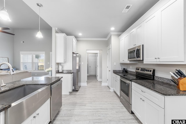 102 Keeter Barn Rd, Camden, NC 27976 - kitchen featuring pendant lighting, white cabinets, a sink, and stainless steel appliances