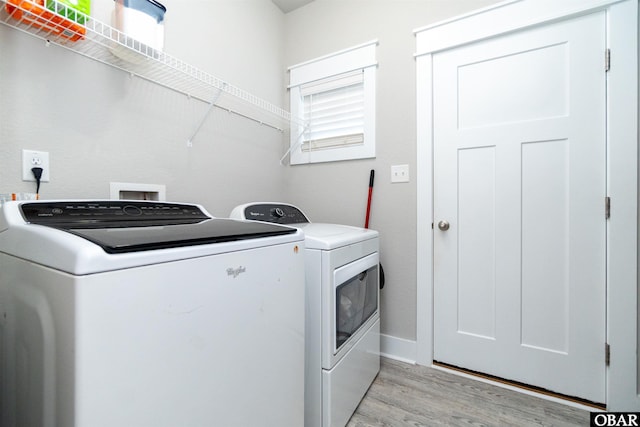 102 Keeter Barn Rd, Camden, NC 27976 - laundry room with light wood finished floors, baseboards, separate washer and dryer, and laundry area