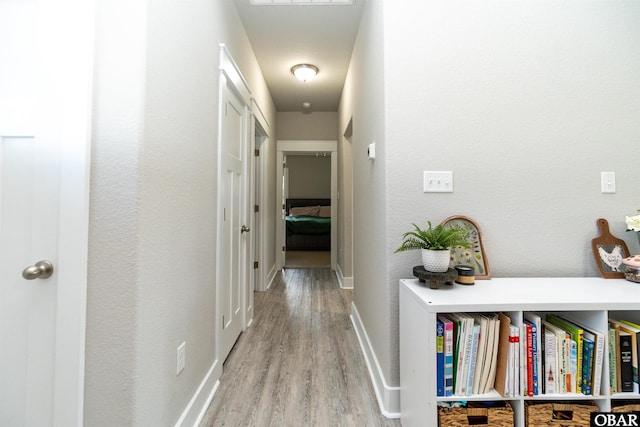 102 Keeter Barn Rd, Camden, NC 27976 - hallway featuring baseboards and light wood finished floors
