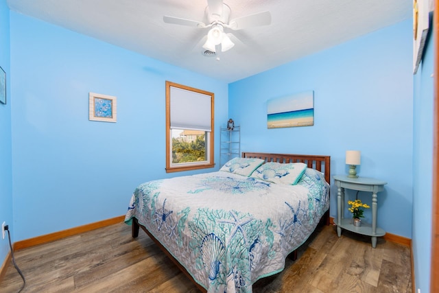 23180 Wimble Shores Dr Lot 8, Rodanthe, NC 27968 - bedroom featuring baseboards, wood finished floors, and ceiling fan