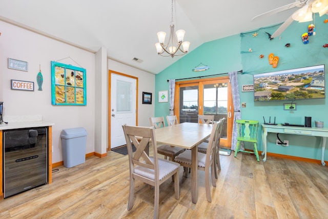 23180 Wimble Shores Dr Lot 8, Rodanthe, NC 27968 - dining room featuring beverage cooler, lofted ceiling, light wood-style floors, a chandelier, and baseboards