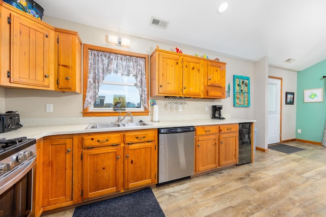 23180 Wimble Shores Dr Lot 8, Rodanthe, NC 27968 - kitchen with stainless steel appliances, a sink, wine cooler, light wood-style floors, and light countertops