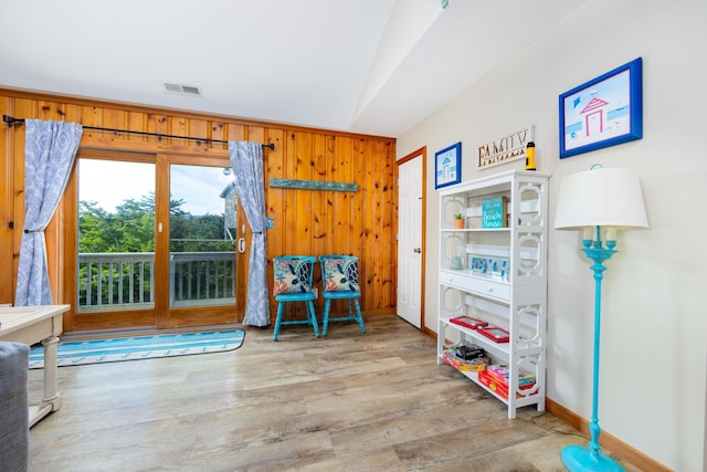 23180 Wimble Shores Dr Lot 8, Rodanthe, NC 27968 - living area featuring wood walls, wood finished floors, baseboards, and lofted ceiling