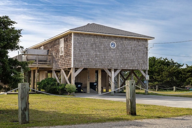 23180 Wimble Shores Dr Lot 8, Rodanthe, NC 27968 - view of home's community featuring a yard, a carport, stairs, and concrete driveway